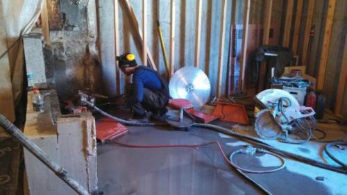 Jake Laplant skillfully removing 12 inch wall from a residence